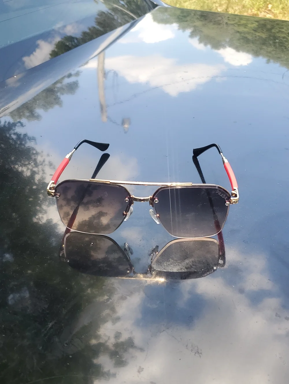 Prada Men’s Aviator Sunglasses - Black Gradient Lenses with Red Temples